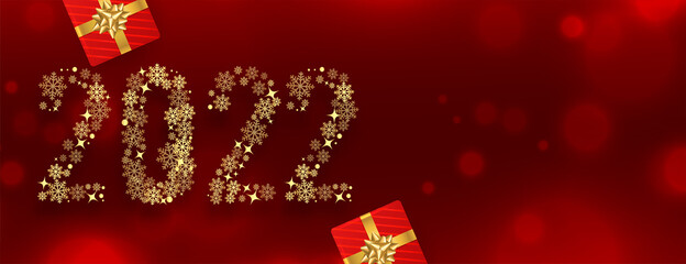 2022 new year red banner made with  golden snowflakes with gift boxex