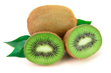 Fototapeta premium A whole kiwi next to another, cut in half. Green leaves lie below