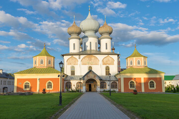 Fototapeta na wymiar The ancient Assumption Cathedral of the Tikhvin Assumption Monastery close up on a sunny August day. Tikhvin, Russia