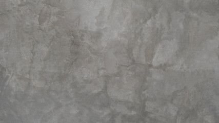 The old cement wall was weathered, the surface was scratched, the surface was scratched and damaged. For a mysterious retro-conservative background.