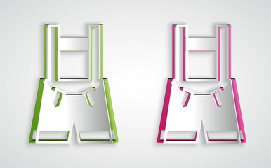 Paper cut Lederhosen icon isolated on grey background. Traditional bavarian clothing. Oktoberfest outfit. Pants with suspenders. Patrick day. Paper art style. Vector