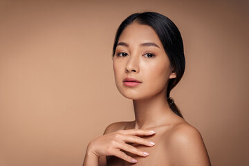 Beauty young asian woman with bare shoulder and clean fresh healthy skin