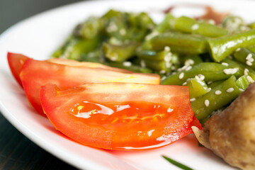 baked asparagus beans with sesame seeds and meat cutlet