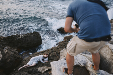 woman lies on a stone near the sea nature landscape