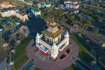 Above the Buddhist temple "Golden Abode of Buddha Shakyamuni" on a sunny morning (aerial photography). Elista, Russia