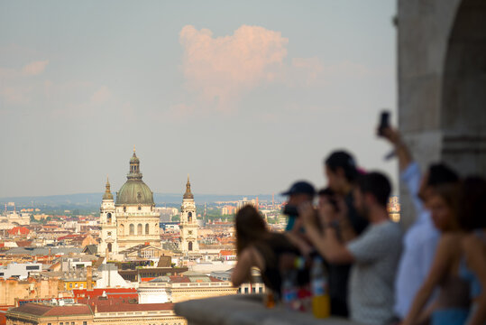 Blurred group of people taking pictures of St. Stephen's Basilica in Budapest