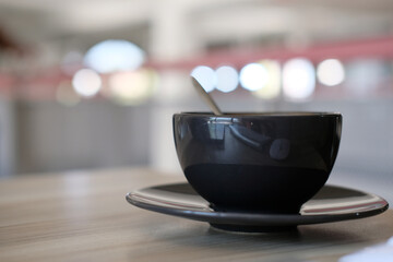 Coffee cup on wood table background 