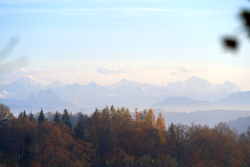 Naklejka na ściany i meble Scenic panoramic landscape with Swiss alps in the background and sea of fog on a sunny autumn day. Photo taken November 12th, 2021, Zurich, Switzerland.