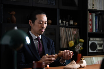 Dedicated shoemaker businessman Asian (Japanese) male.