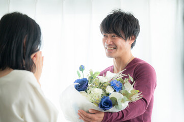 Portrait of Asian (Japanese) couple or couples giving gifts. Copy space available.	
