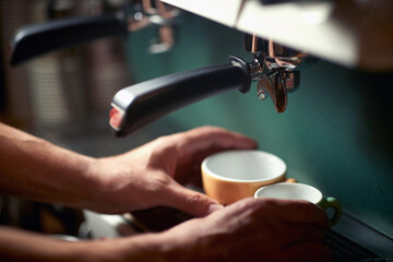 Fototapeta na wymiar Barman putting cups into espresso apparatus. Coffee, beverage, bar