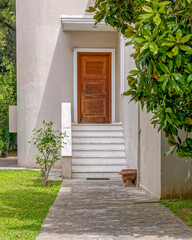 contemporary house entrance with white marble stairs and wooden door, Athens Greece