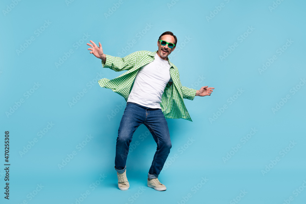 Sticker Full length body size view of attractive cheerful man dancing resting enjoying isolated over vivid blue color background