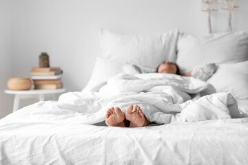 Fototapeta na wymiar Morning of sleeping young woman in bed