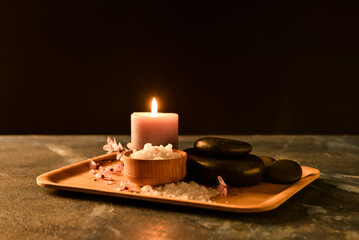 Tray with spa composition on table against black background