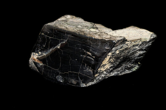 Macro stone mineral jet lignite on a black background