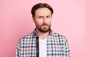 Fototapeta premium Photo of young man unhappy upset amazed shocked information frustrated isolated over pink color background