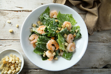Homemade Caesar salad with shrimps