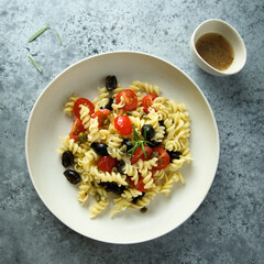 Pasta with tomatoes and olives
