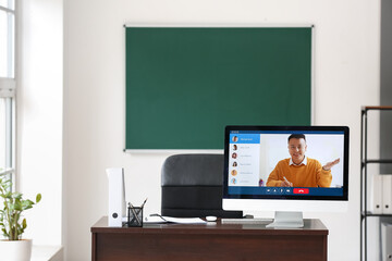 School teacher conducting lesson online