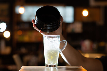 pouring hot matcha in latte of cafe mood