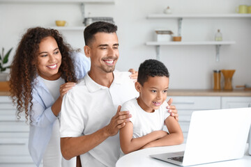 Interracial family video chatting at home