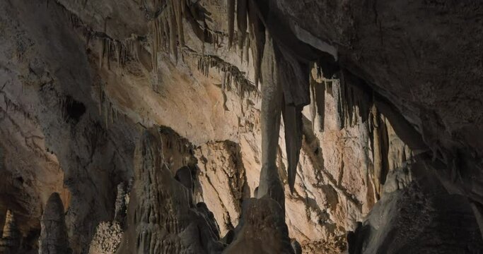 Beautiful shots of karst cave, Lipa Cave situated Serbia, East Europe. Illuminated dark cave with stalactites and stalagmites. Unique nature landscape. High quality 4k footage