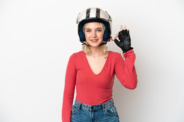 Young caucasian woman with a motorcycle helmet isolated on white background showing ok sign with fingers