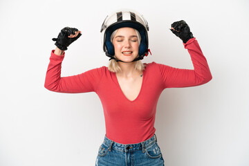 Young caucasian woman with a motorcycle helmet isolated on white background doing strong gesture
