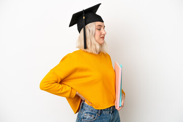 Young university caucasian woman graduate isolated on white background suffering from backache for having made an effort