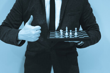 Chess board game to represent the business strategy with competition in the world market. and find out the best solution to meet target objective and goal. Sign and symbol of challenging as concept.	

