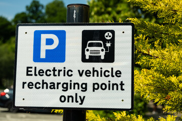 A sign indicating an electric vehicle recharging point or parking space
