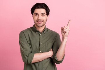 Photo of young happy charming cheerful man point finger empty space sale news isolated on pink color background