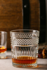 Glass of chestnut whiskey on table