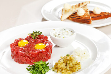 tasty tartare  with sauce and pickles