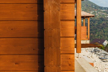 Part of a wooden house in a modern style. The concept of eco-friendly housing.