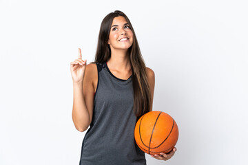 Young brazilian woman playing basketball isolated on white background pointing up a great idea