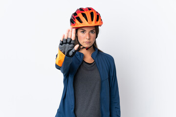 Young cyclist brazilian girl isolated on white  background making stop gesture - obrazy, fototapety, plakaty