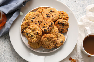 Plate with tasty homemade cookies on white background