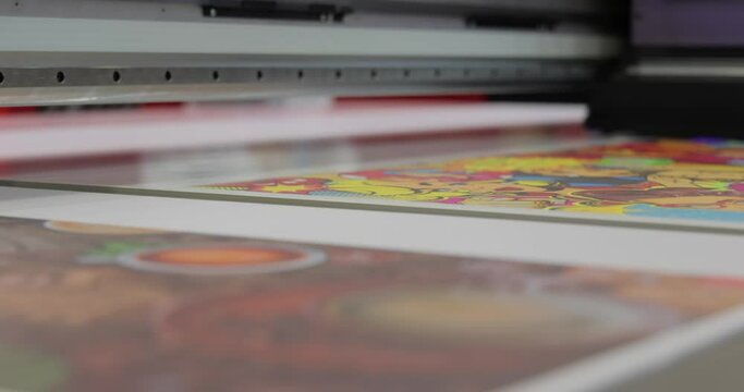 Modern Digital Large format UV printer. Printing production technologies. UV pinning is the process of applying a dose of low intensity ultraviolet light to a UV curable ink