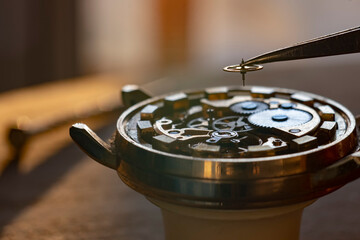 Process of repair of the mechanical watches. Gear switching.