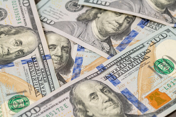 100 US dollars in a pile that fills the entire screen