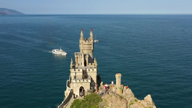 Swallow's Next gothic castle. A popular historical landmark in Crimea among the mountains, cliffs and sea