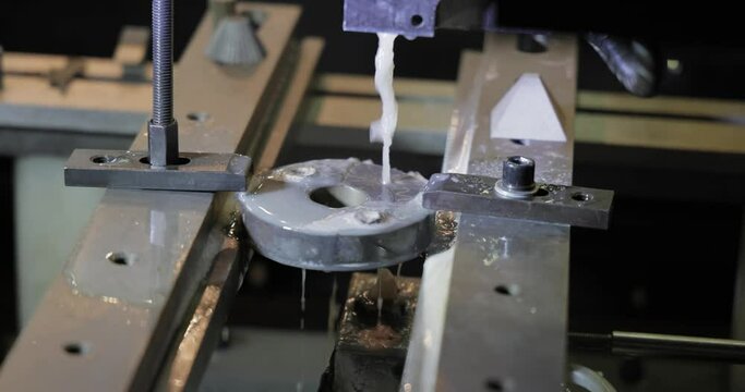 EDM CNC machine while cutting the sample work pieces. Cutting metal modern processing technology Making Industrial Details.