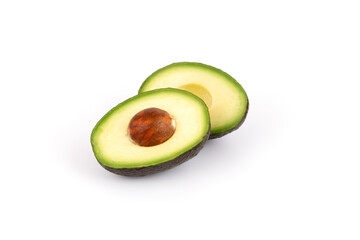 Fresh and ripe avocado whole and cut in half, healthy fruit isolated
