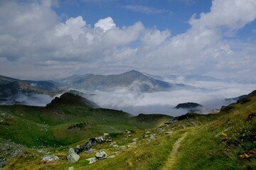 Beautiful mountain view above clouds during hiking on peak Djeravica (Gjerovica) - the highest peak of Kosovo. Albanian Alps, Peaks of Balkans