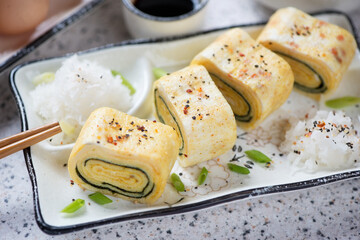 Close-up of sliced tamagoyaki or sweetened japanese egg roll, selective focus, studio shot