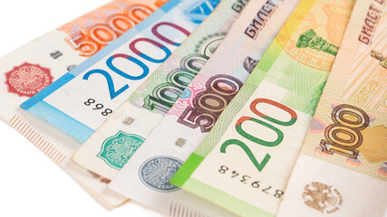Close-up of banknotes. Five thousand, five hundred, ten thousand, lead and one hundred rubles.