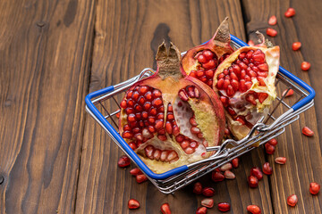 Juicy pomegranate in a shopping trolley