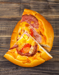 Pizza on a wooden table.